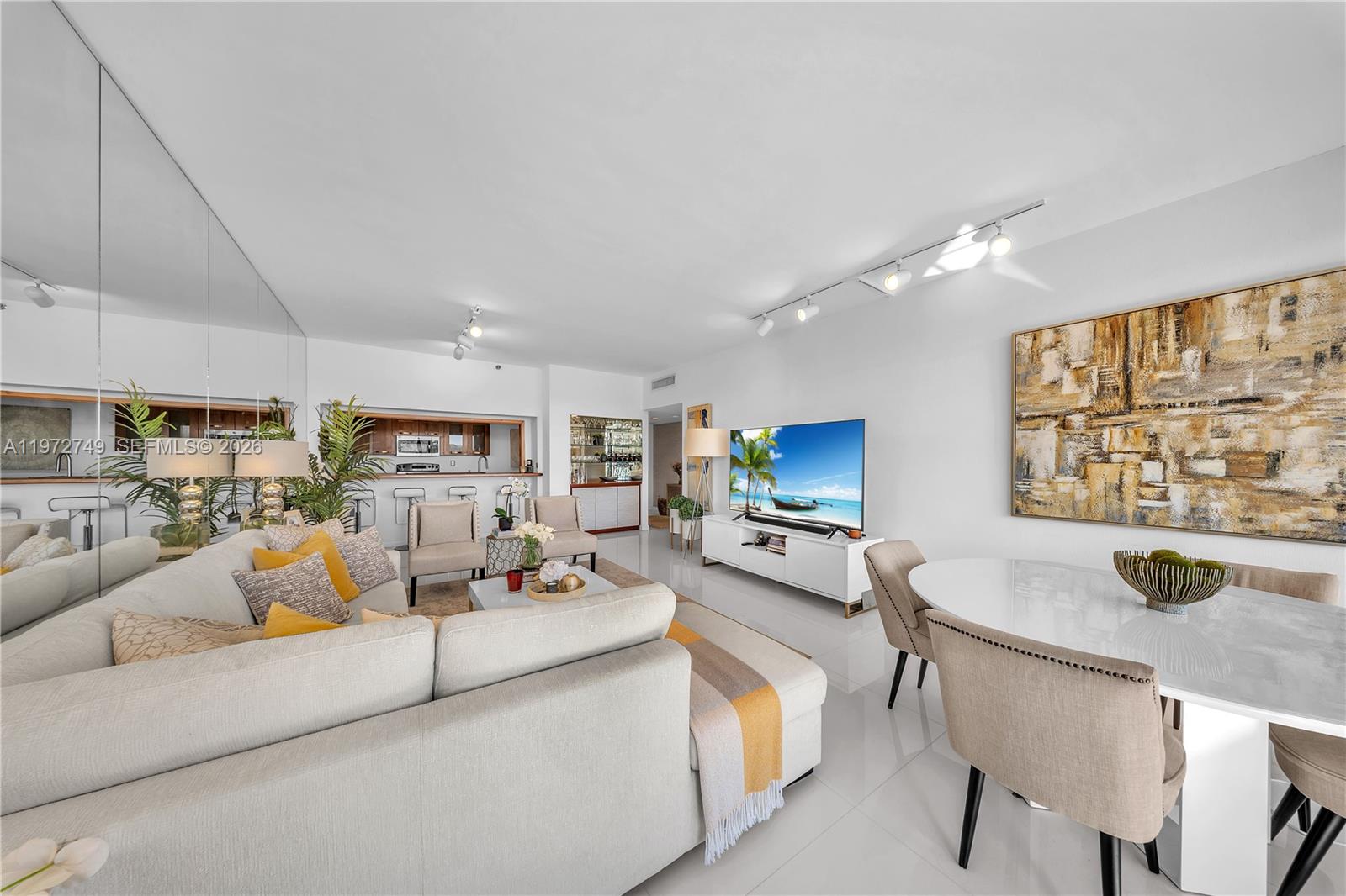 Key Colony Condominiums Key Biscayne, FL 33149 - Photo 2 of 20 a living room with furniture and a flat screen tv