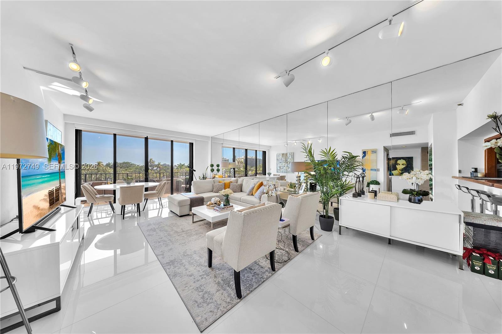 Key Colony Condominiums Key Biscayne, FL 33149 - Photo 3 of 20 a living room with furniture and a large window