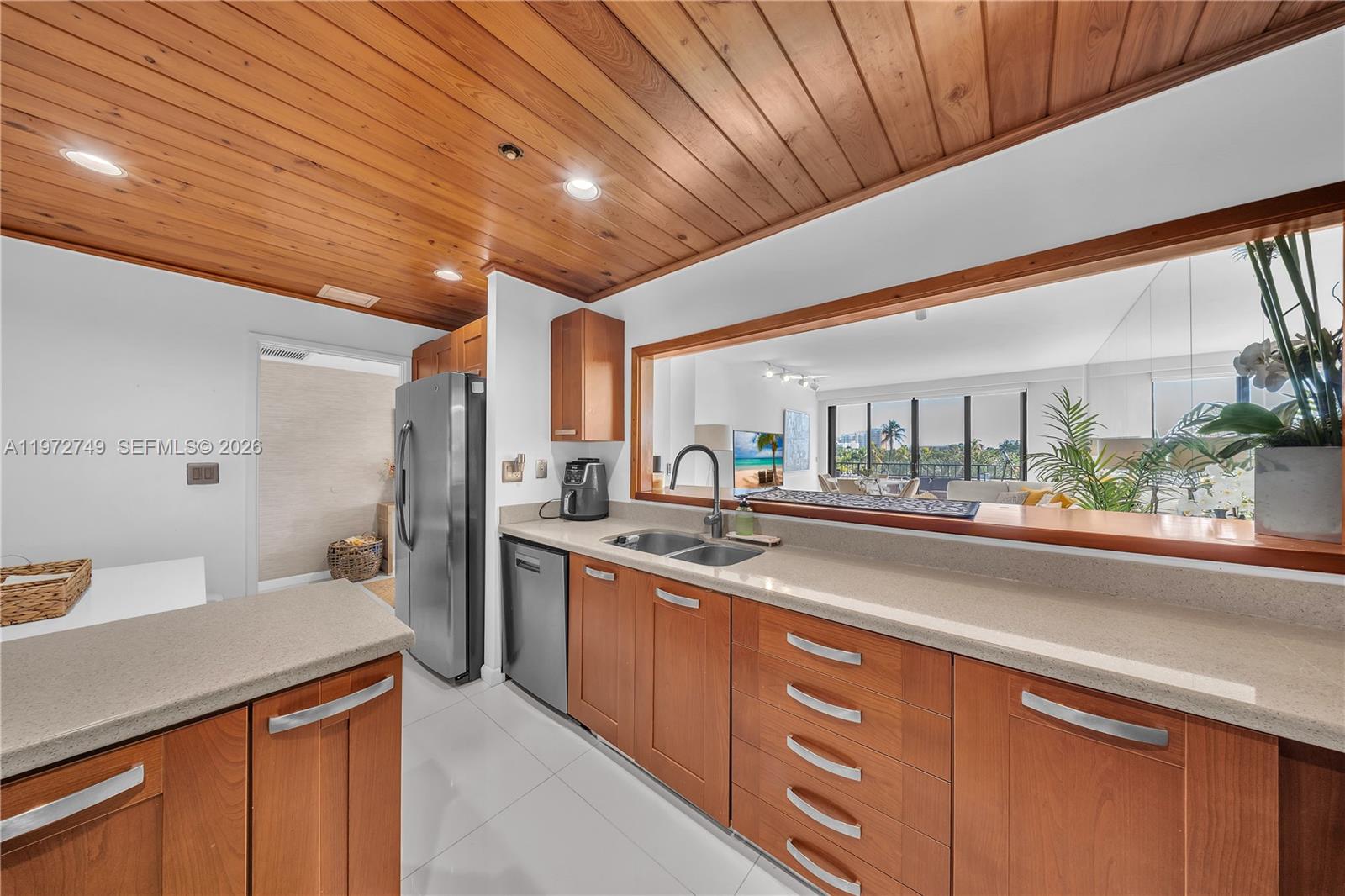 Key Colony Condominiums Key Biscayne, FL 33149 - Photo 5 of 20 a kitchen with stainless steel appliances granite countertop a sink and cabinets