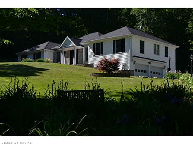 323 Taylor Brook Road Winchester, CT 06098 - Photo 1 of 1 a front view of a house with a garden
