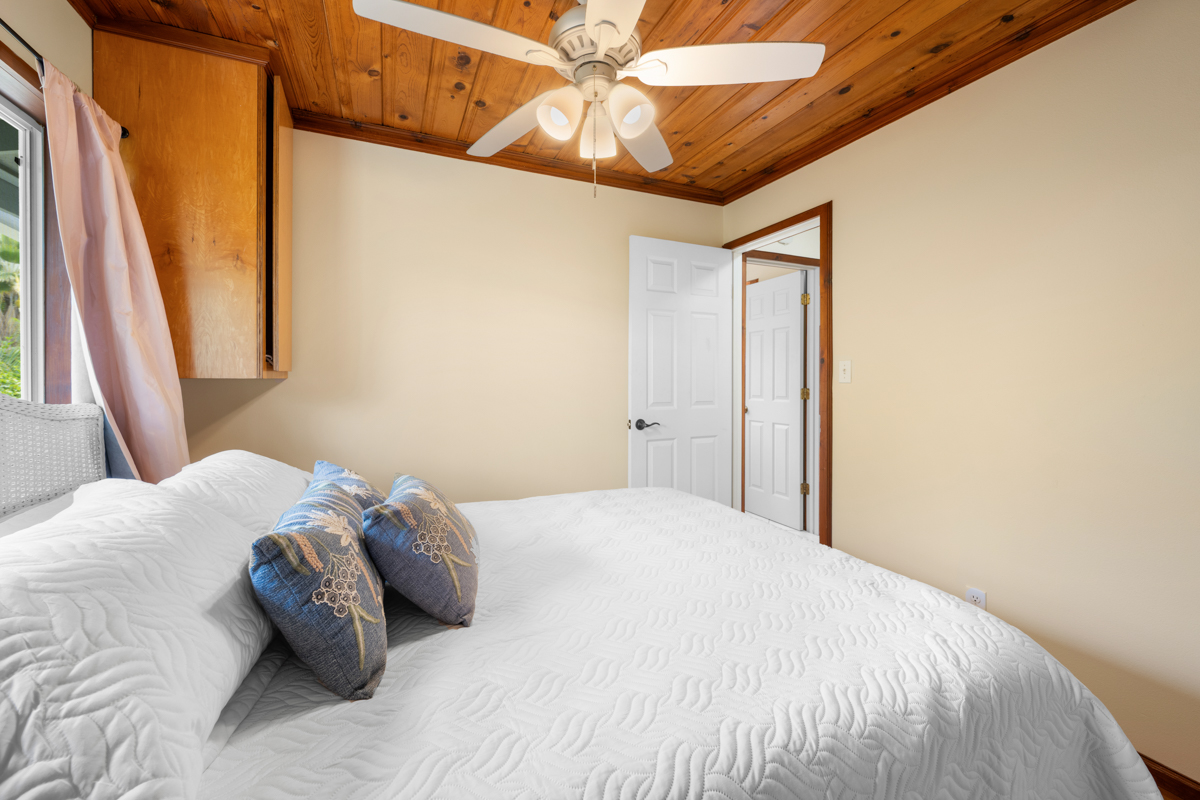 76-6179 Mania Road Kailua-Kona, HI 96740 - Photo 12 of 30 a bedroom with a bed and a window