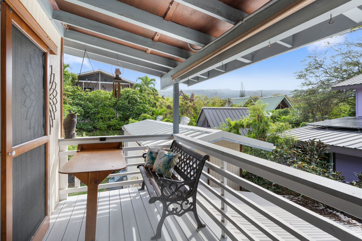 76-6179 Mania Road Kailua-Kona, HI 96740 - Photo 14 of 30 a view of balcony with chairs and wooden floor