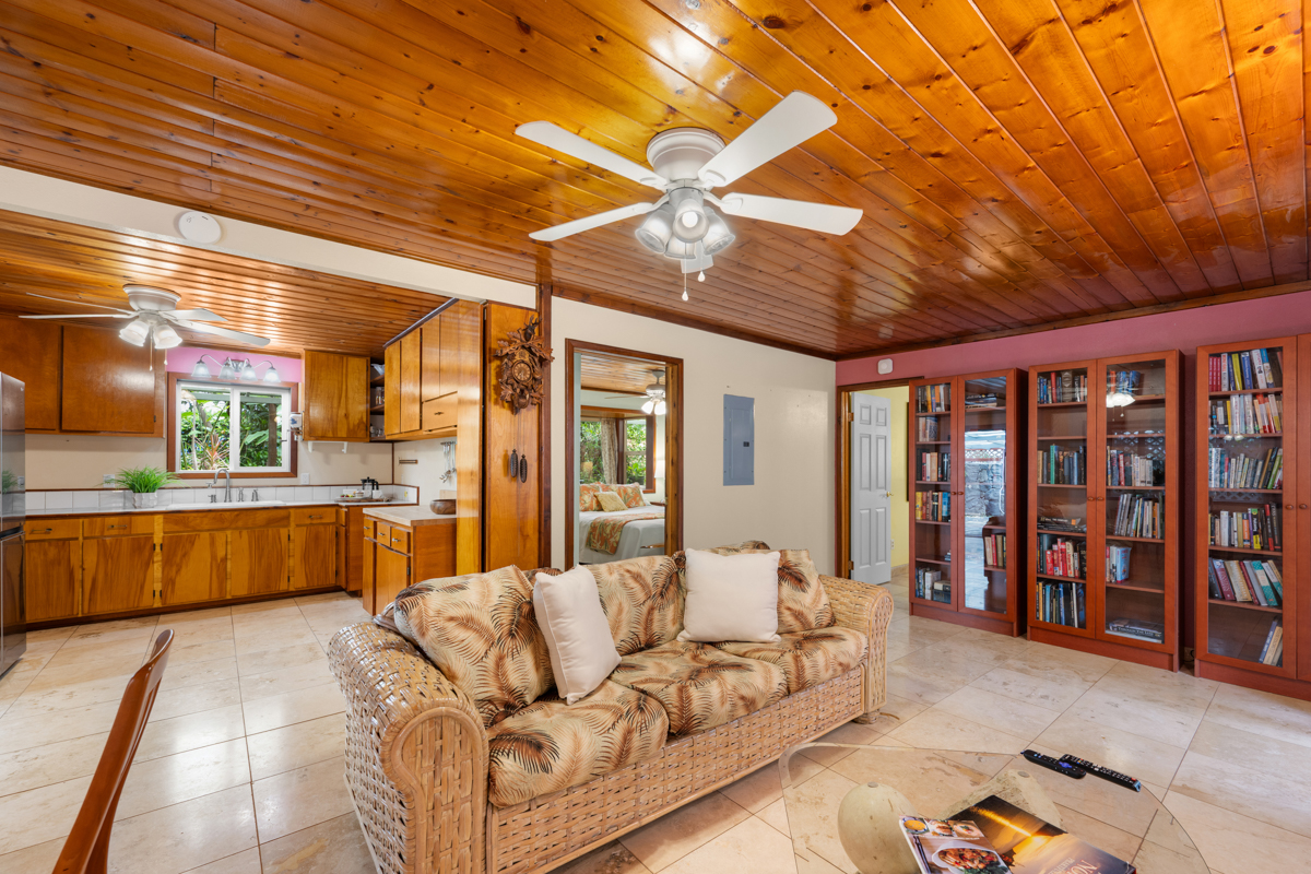 76-6179 Mania Road Kailua-Kona, HI 96740 - Photo 18 of 30 a living room with furniture a ceiling fan and a rug