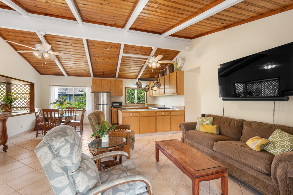 76-6179 Mania Road Kailua-Kona, HI 96740 - Photo 3 of 30 a living room with furniture and a flat screen tv