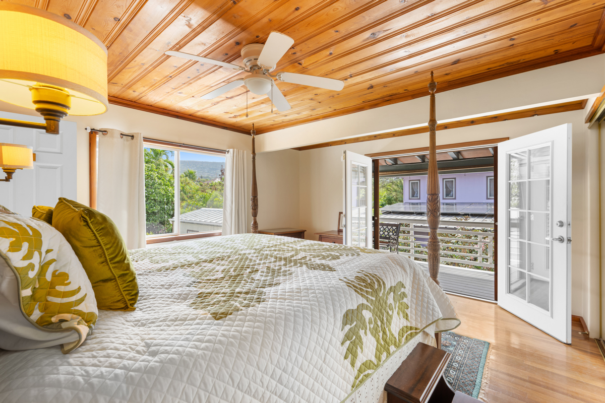 76-6179 Mania Road Kailua-Kona, HI 96740 - Photo 8 of 30 a bedroom with a bed and wooden floor