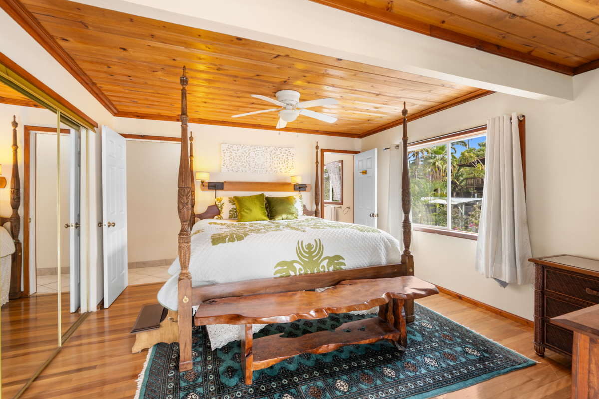 76-6179 Mania Road Kailua-Kona, HI 96740 - Photo 9 of 30 a bed sitting in a bedroom next to a window