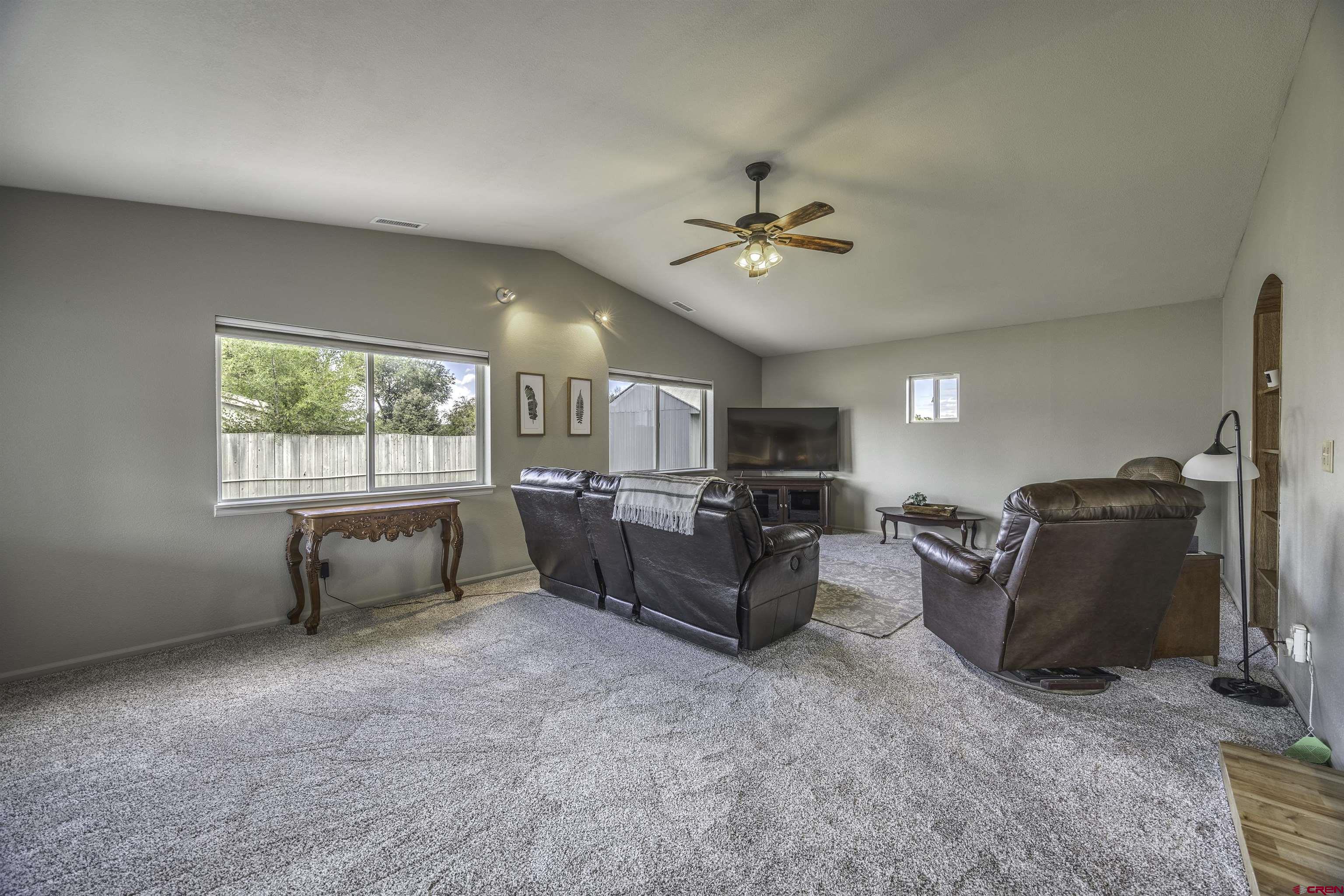 16303 6420th Road Montrose, CO 81403 - Photo 11 of 31 a living room with furniture and a window