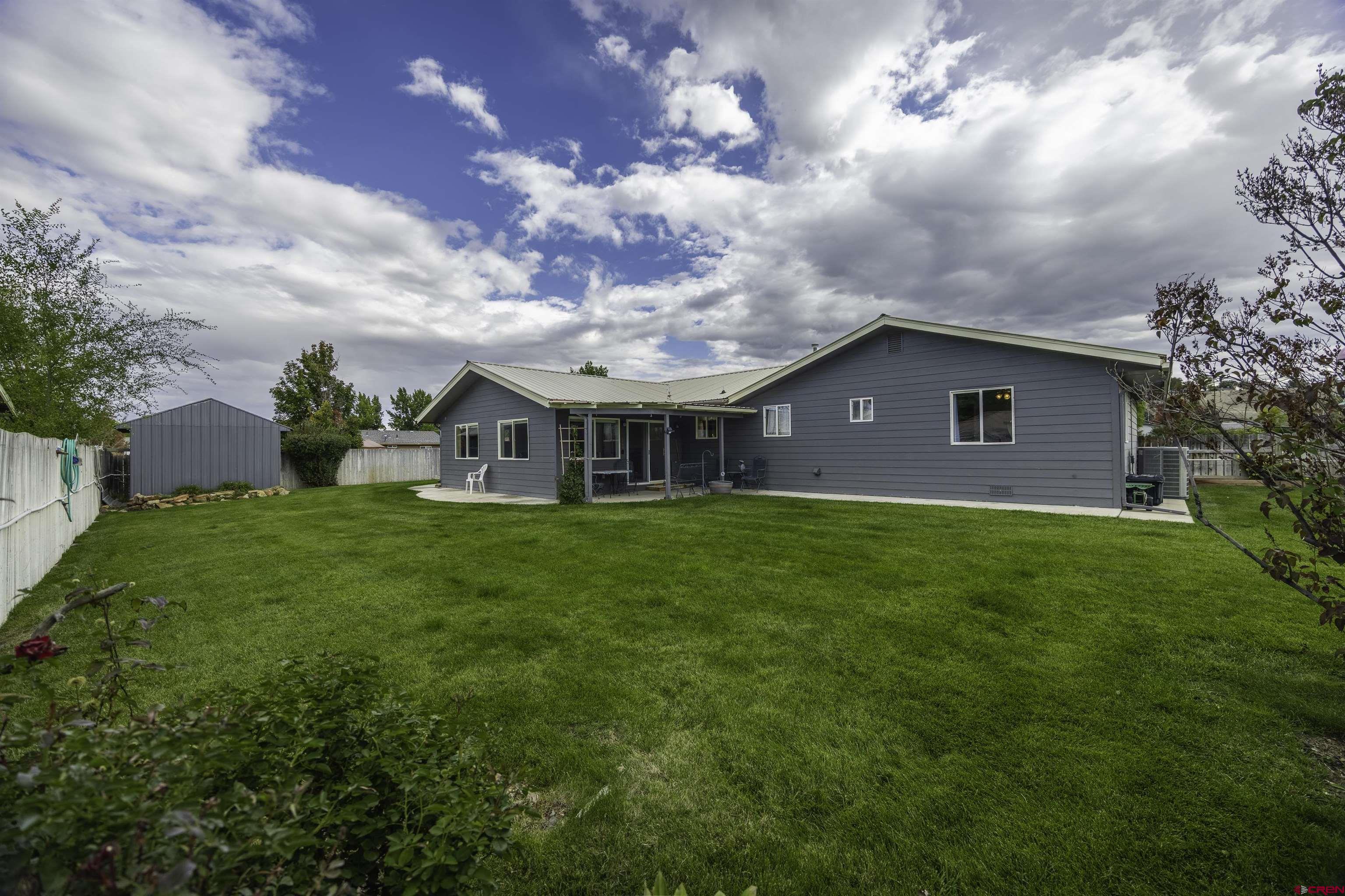 16303 6420th Road Montrose, CO 81403 - Photo 24 of 31 a view of a house with a backyard