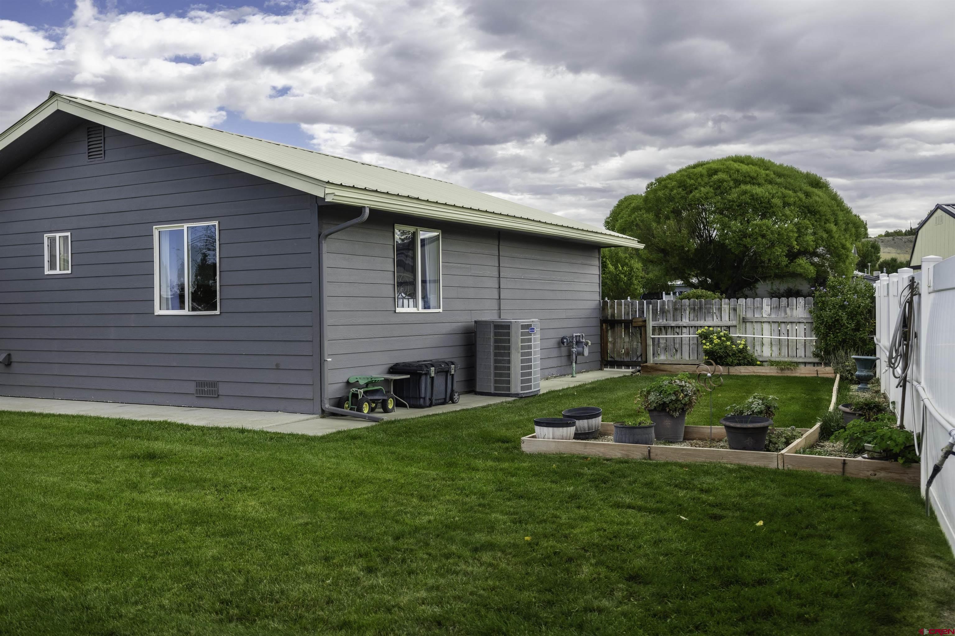 16303 6420th Road Montrose, CO 81403 - Photo 26 of 31 a view of a house with a backyard