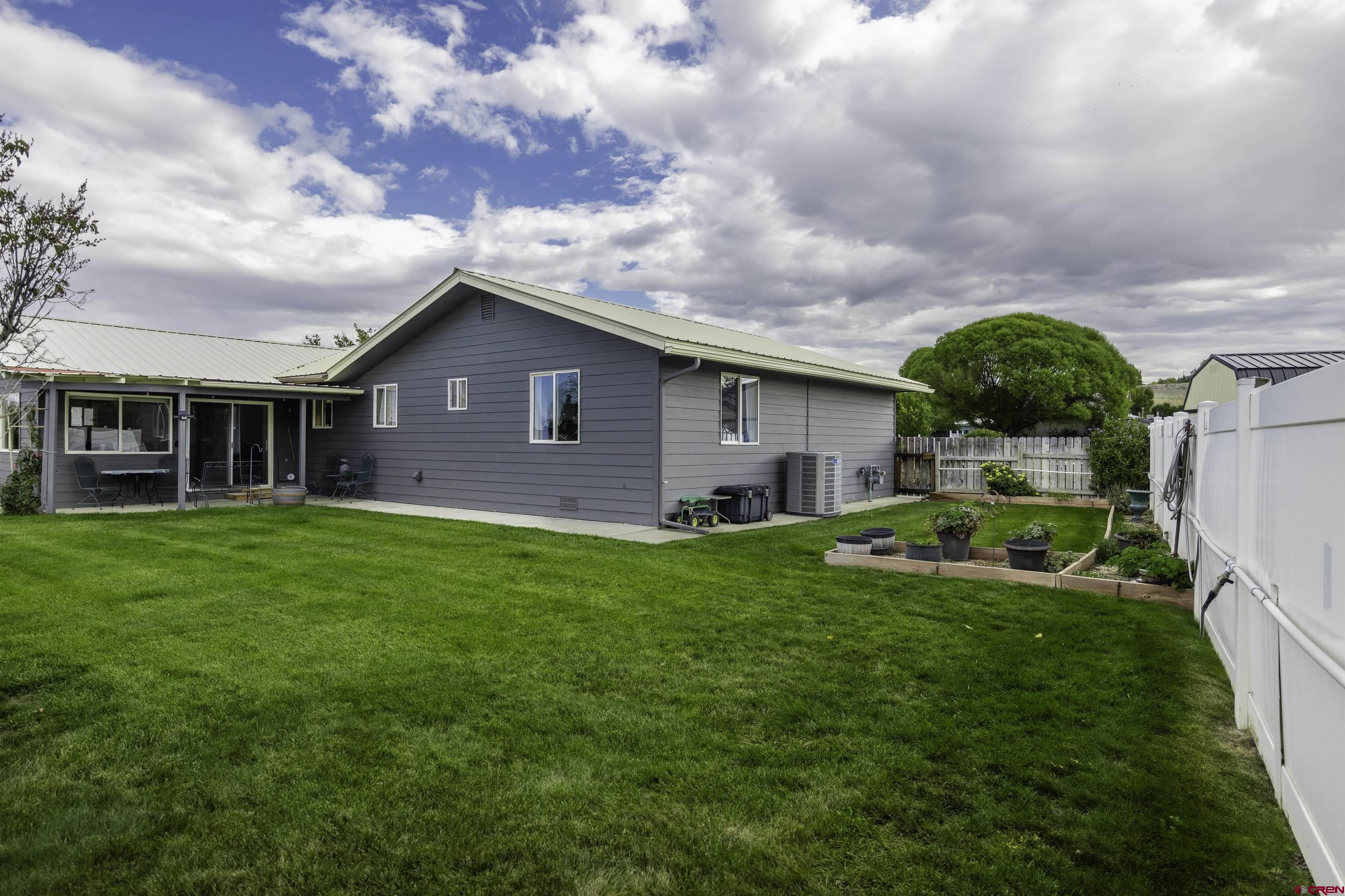 16303 6420th Road Montrose, CO 81403 - Photo 27 of 31 a front view of house with yard and green space