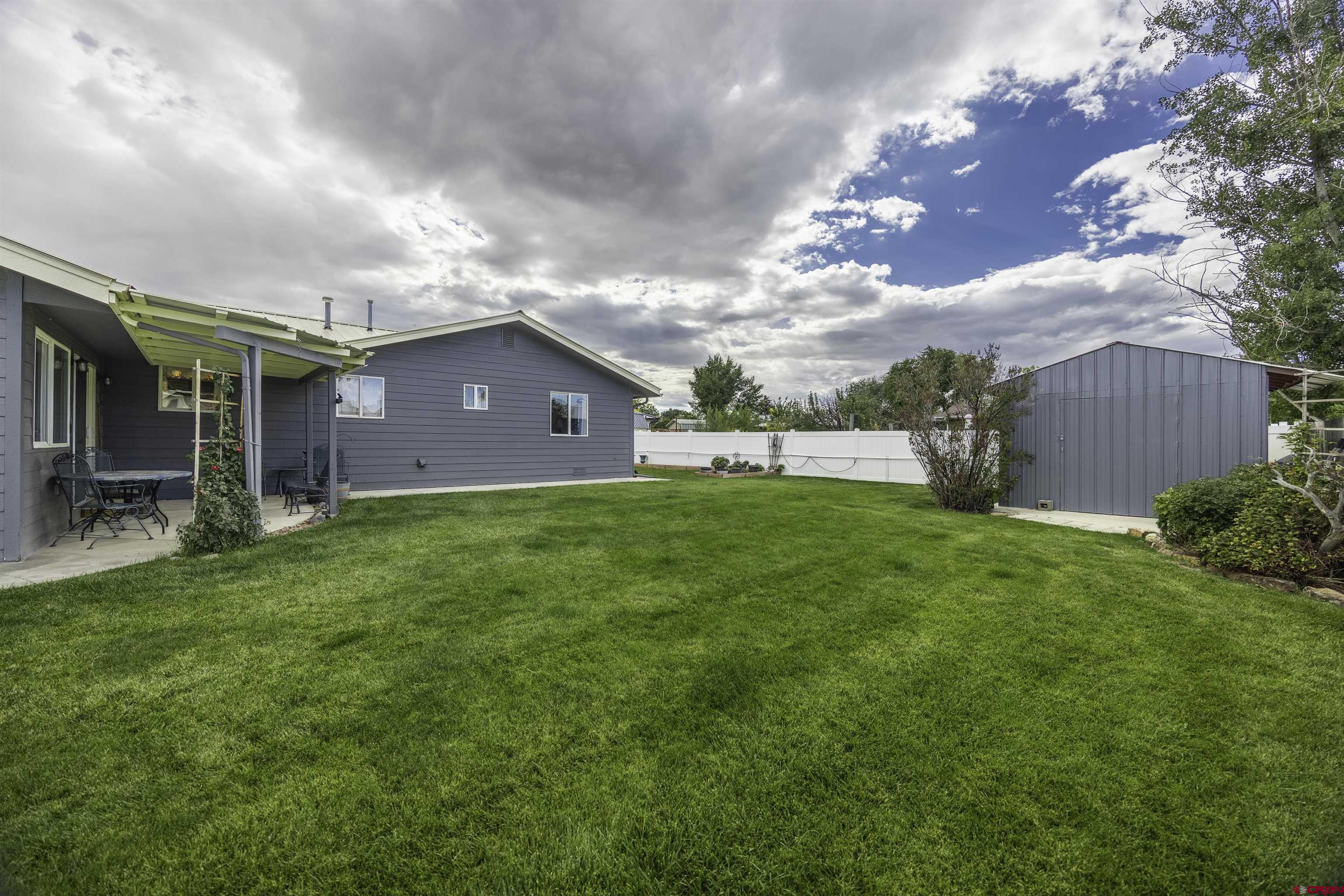 16303 6420th Road Montrose, CO 81403 - Photo 29 of 31 a view of an house with backyard and garden