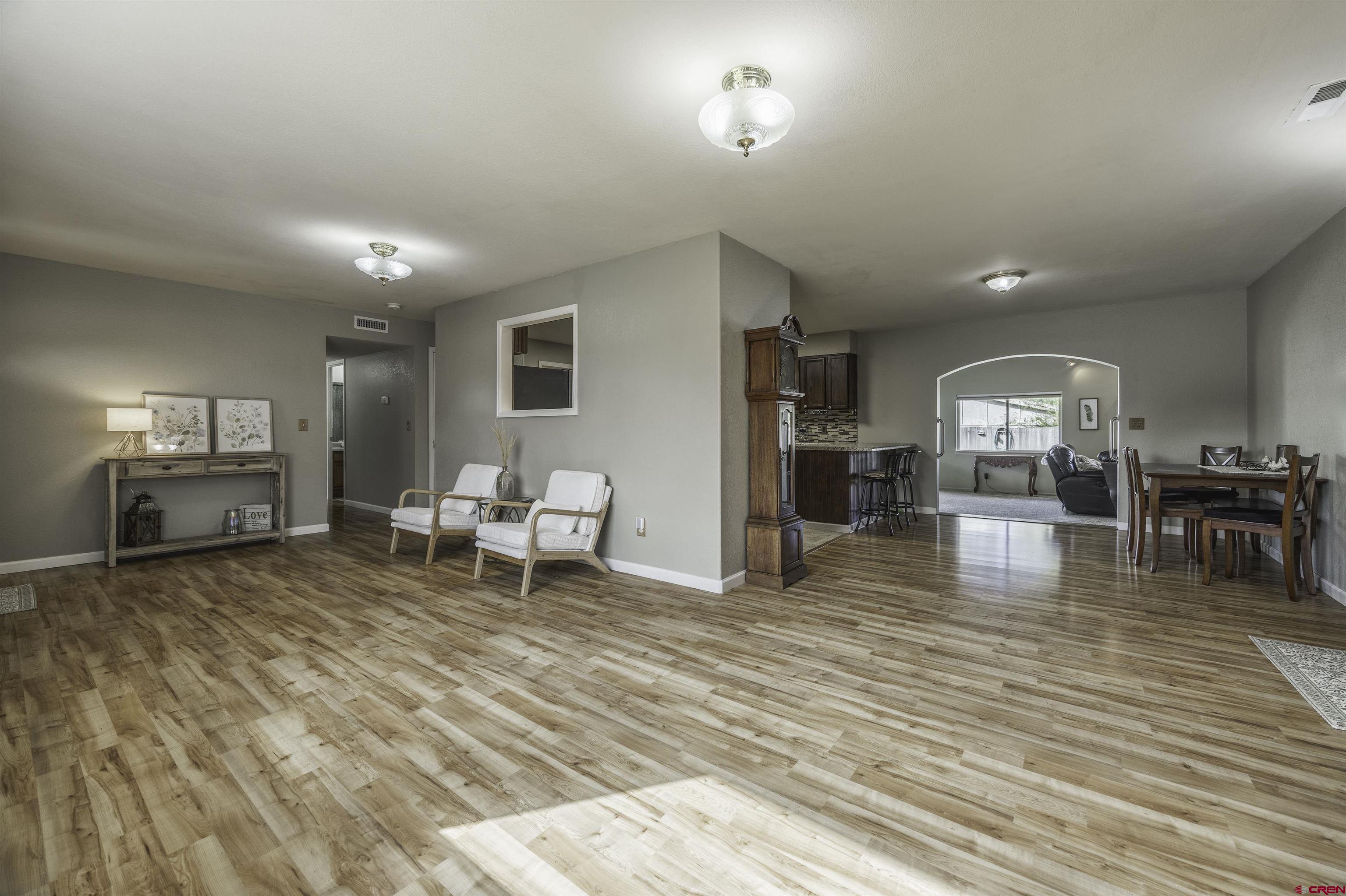 16303 6420th Road Montrose, CO 81403 - Photo 3 of 31 a living room with furniture and a table