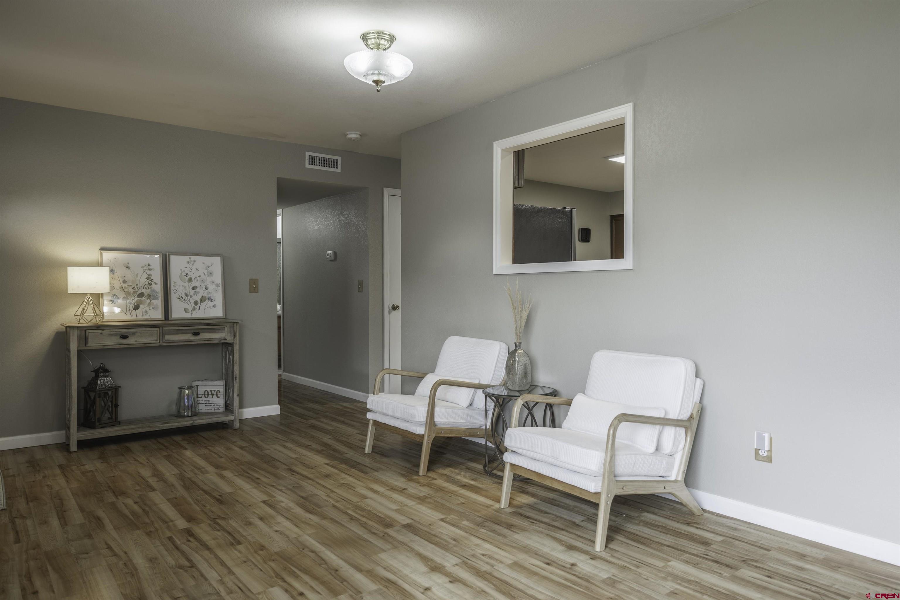 16303 6420th Road Montrose, CO 81403 - Photo 4 of 31 a living room with furniture and a wooden floor