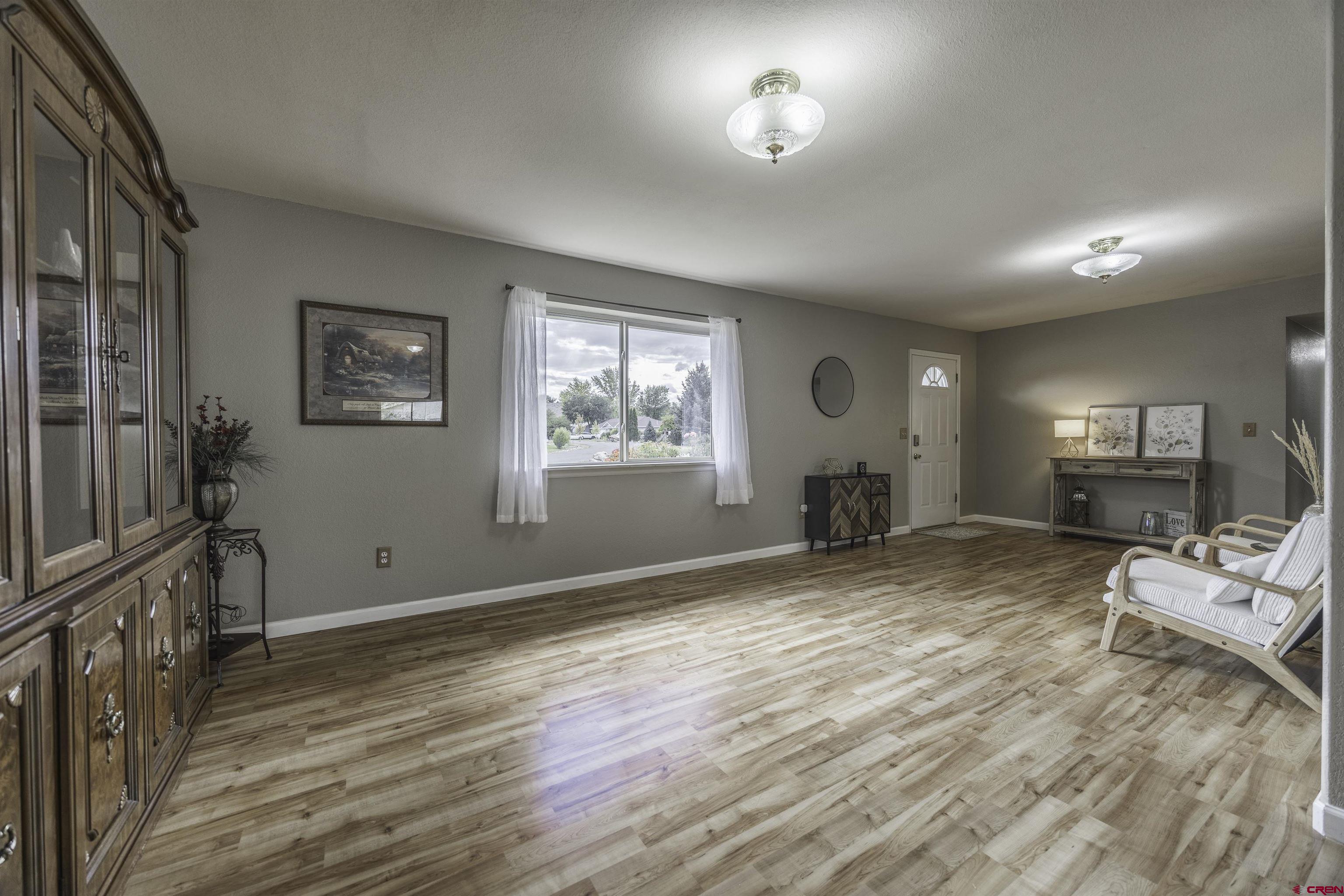 16303 6420th Road Montrose, CO 81403 - Photo 6 of 31 a view of livingroom with furniture and windows