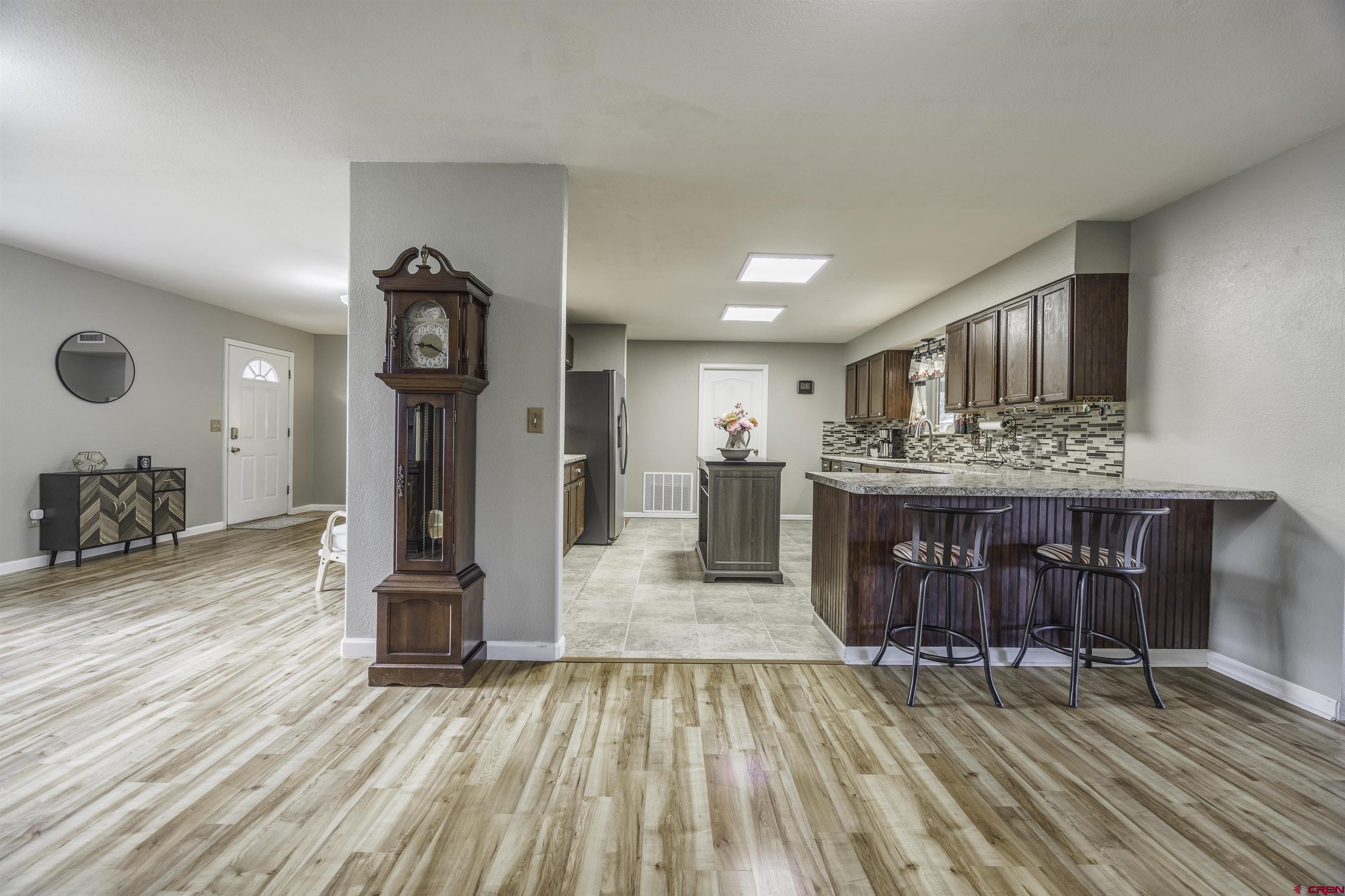 16303 6420th Road Montrose, CO 81403 - Photo 7 of 31 a living room with furniture and a wooden floor