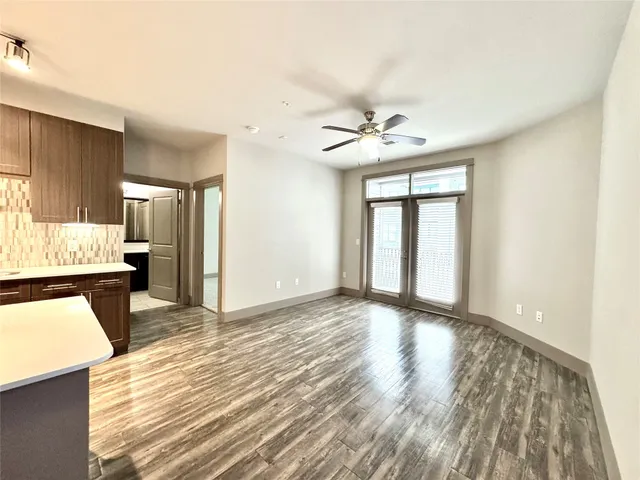 a view of a kitchen with a sink and a window