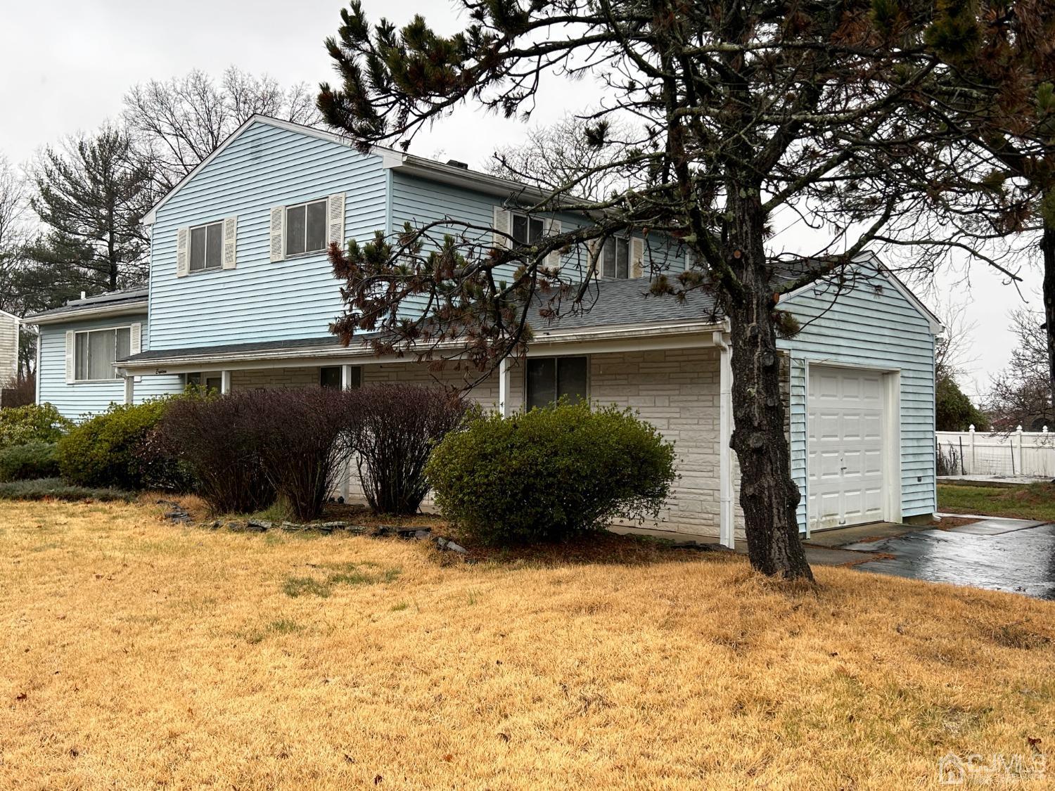 18 Lexington Road Somerset, NJ 08873 - Photo 3 of 34 a front view of a house with a yard