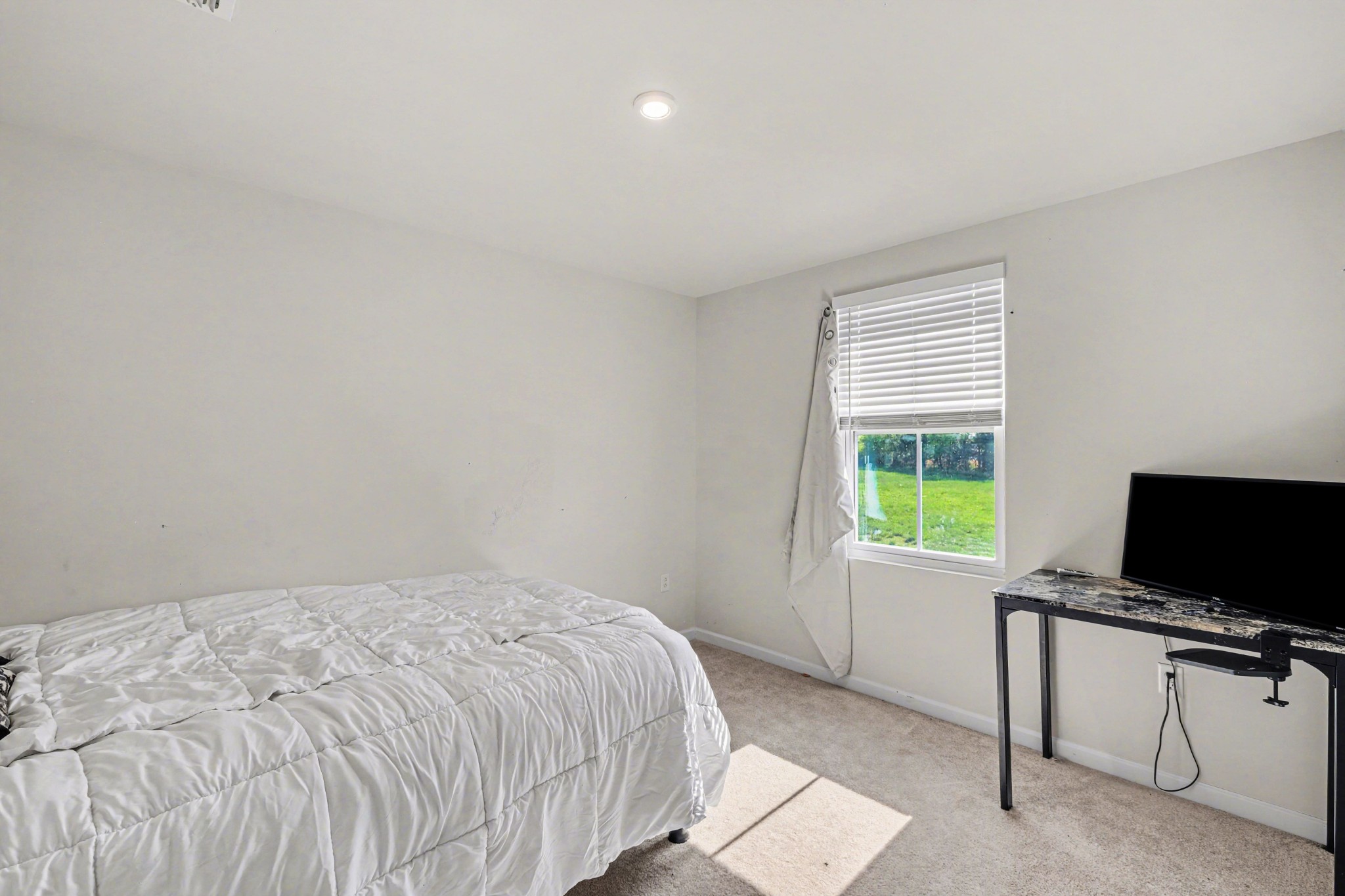 5778 Stardive Way Christiana, TN 37037 - Photo 21 of 29 a bedroom with a bed and a flat screen tv