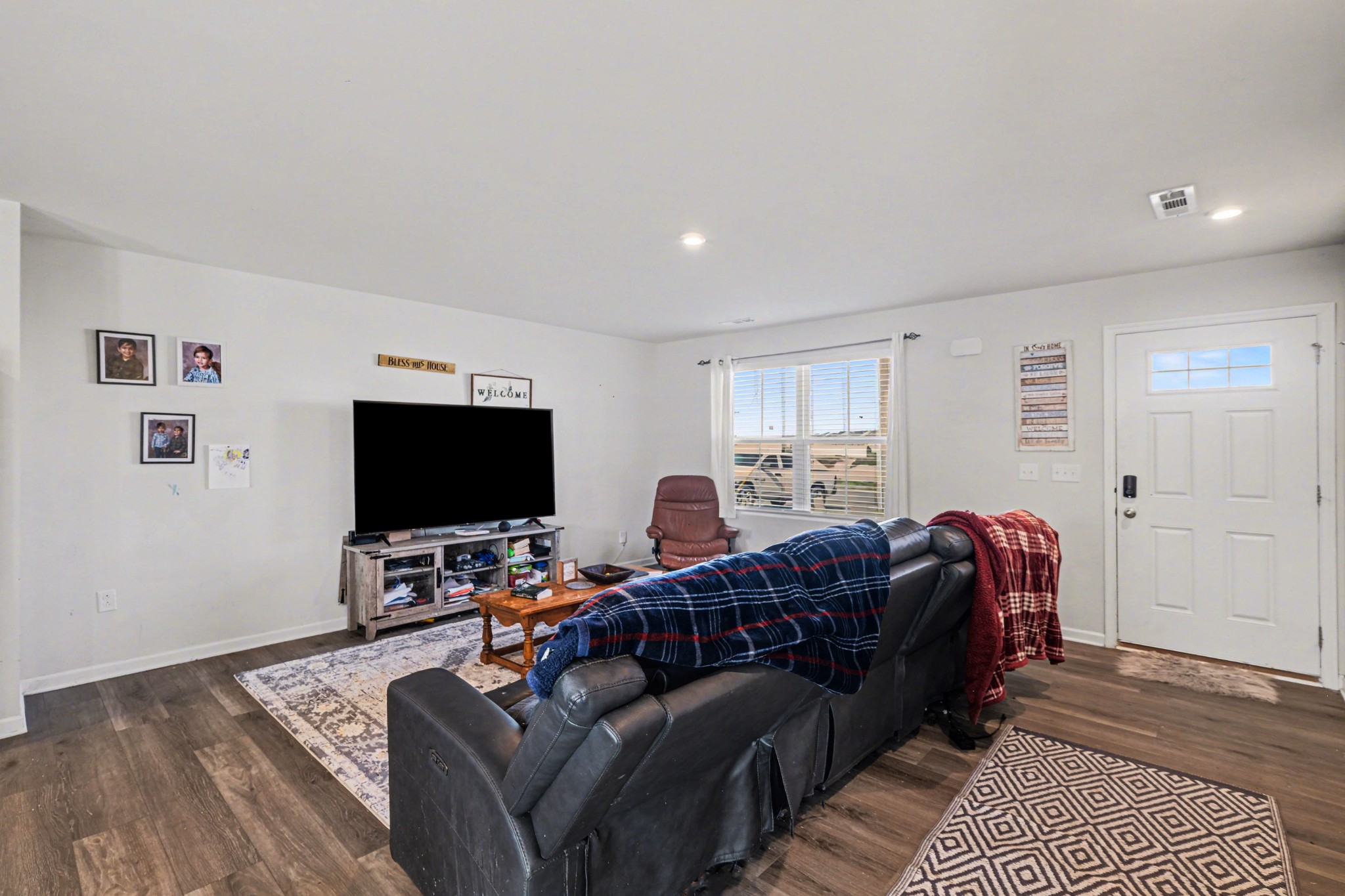 5778 Stardive Way Christiana, TN 37037 - Photo 5 of 29 a living room with furniture and a flat screen tv