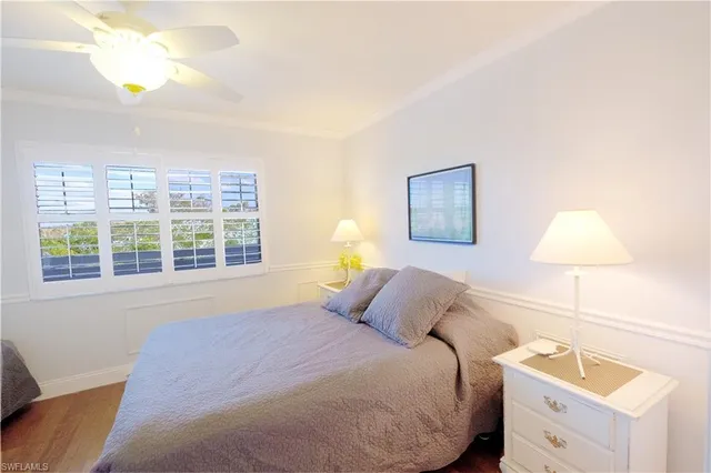 a bedroom with a bed and a lamp