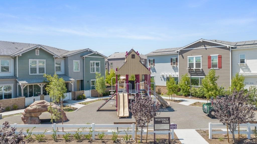 211 Red Brick Drive, Unit 3 Simi Valley, CA 93065 - Photo 10 of 13 a front view of a house with a yard and potted plants