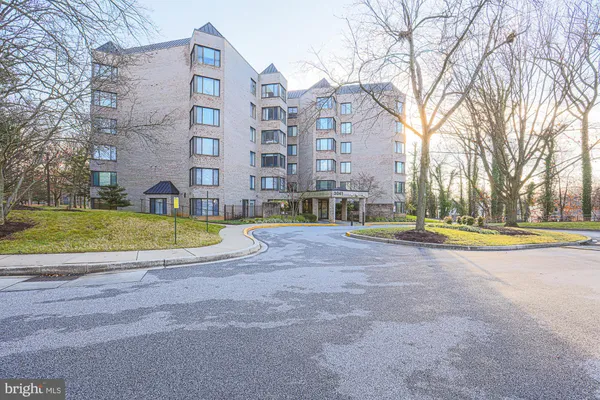 a view of building with a swimming pool