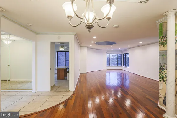 a view of an entryway with wooden floor