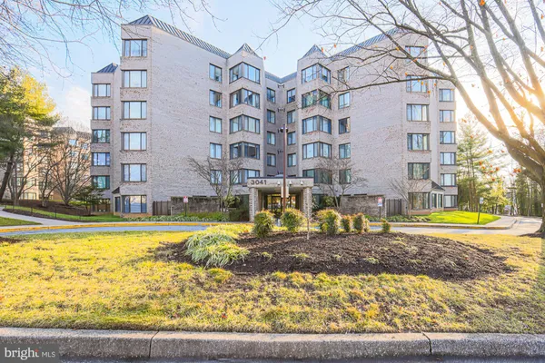 a building with trees in front of it