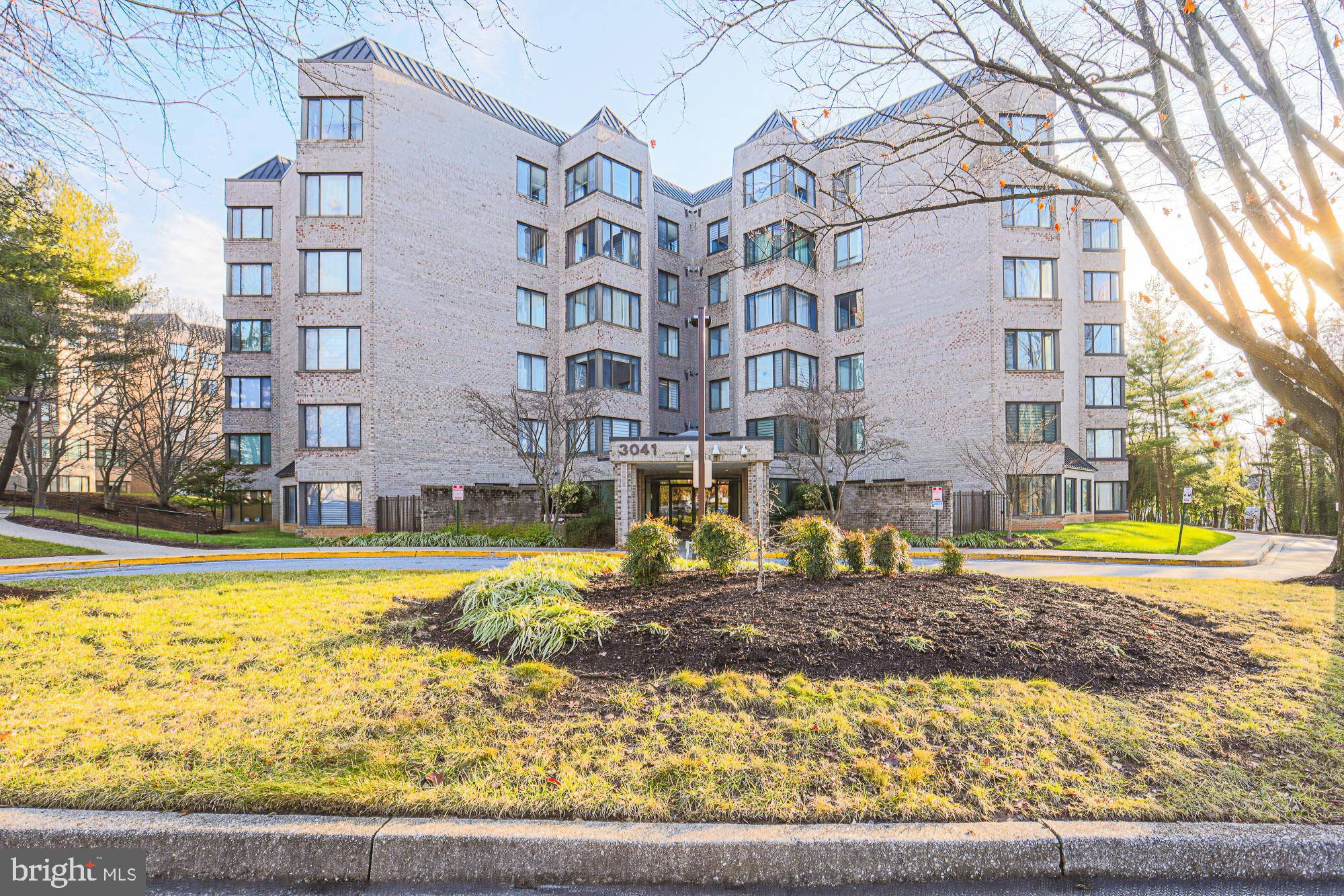 3041 Fallstaff Road, Unit 405D Baltimore, MD 21209 - Photo 2 of 38 a building with trees in front of it