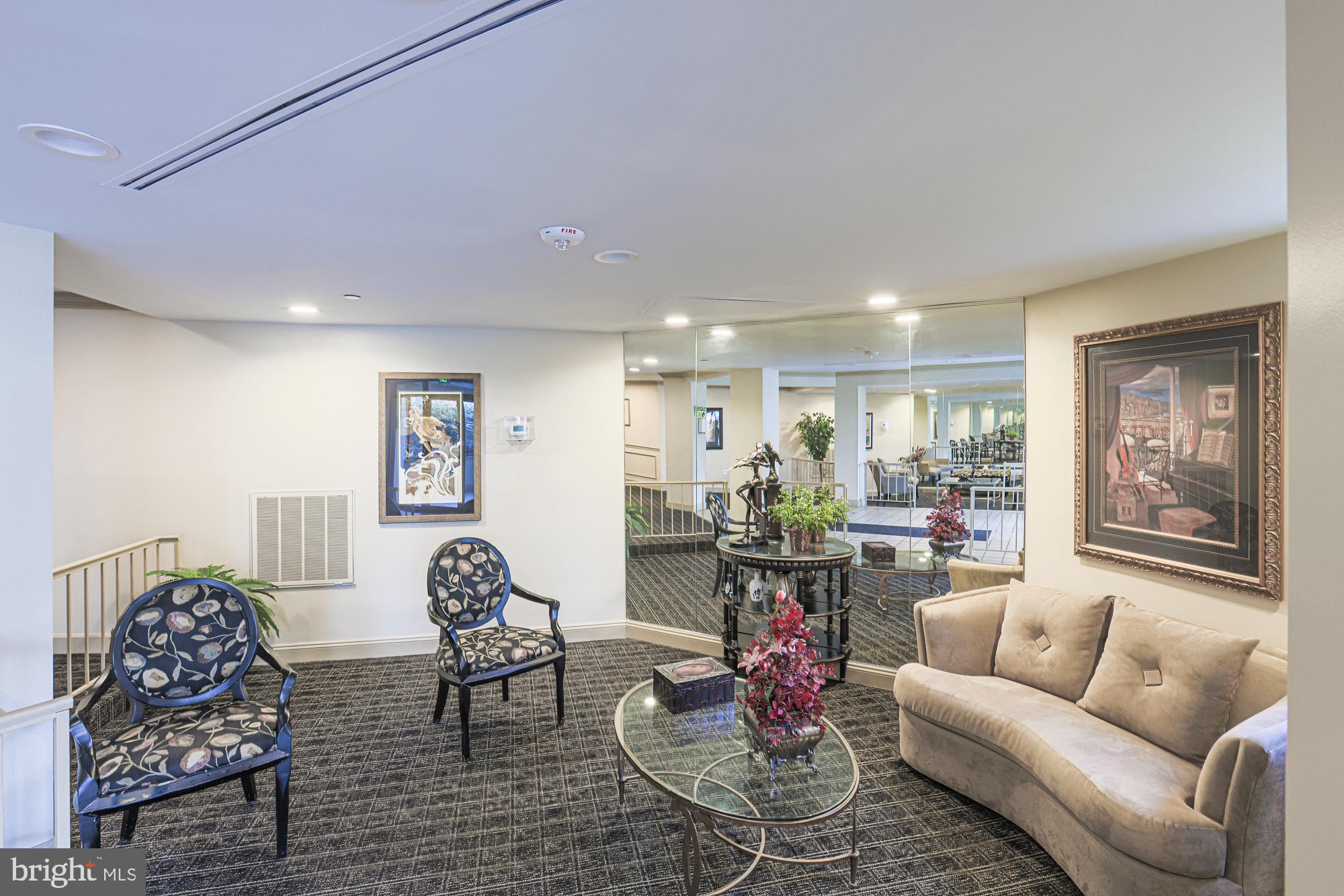 3041 Fallstaff Road, Unit 405D Baltimore, MD 21209 - Photo 6 of 38 a living room with furniture and a large window