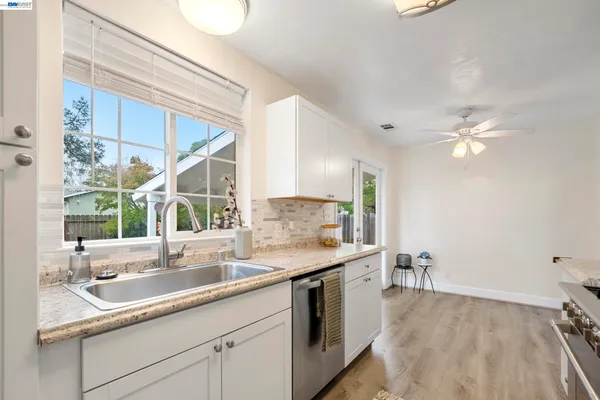 a kitchen with a sink and a window