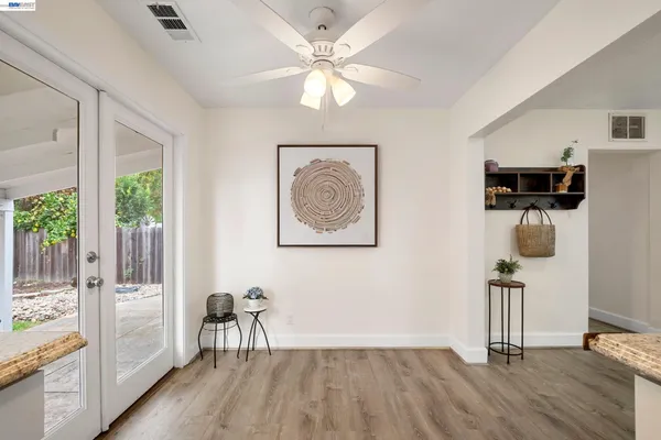 a view of a livingroom with workspace and a window