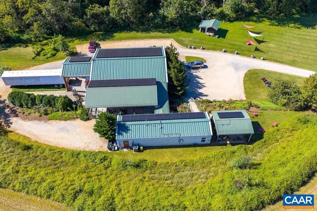 9175 Batesville Road Afton, VA 22920 - Photo 58 of 74 Winery with tasting room, outdoor seating, production building, and covered stage with sun shades.