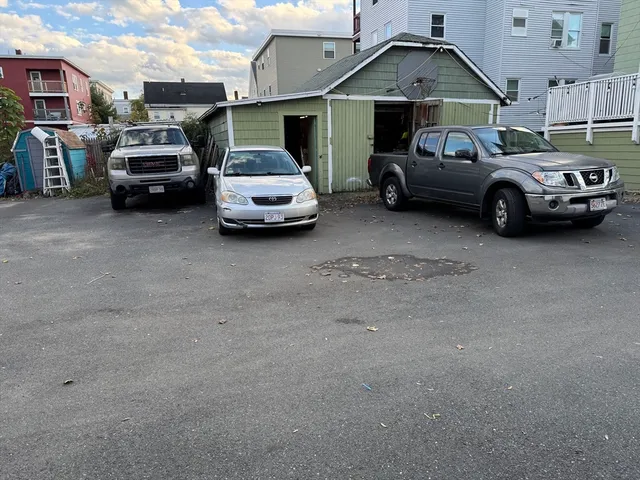 a view of car parked in front of a house