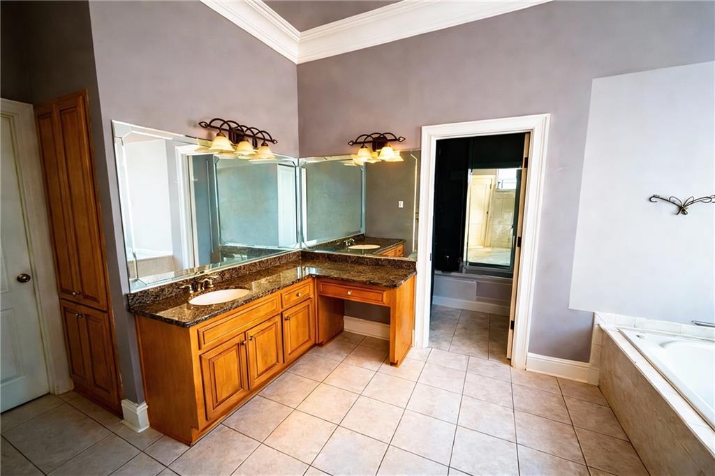 3930 Demooney Road Atlanta, GA 30349 - Photo 17 of 36 a large kitchen with a stove and a refrigerator