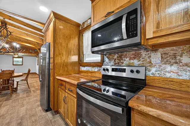 a kitchen with a stove and a microwave