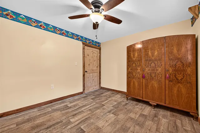 a view of an empty room and wooden floor