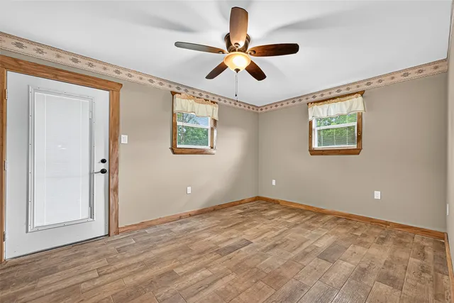 a view of room with window and ceiling fan