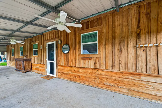 a view of a room with wooden walls