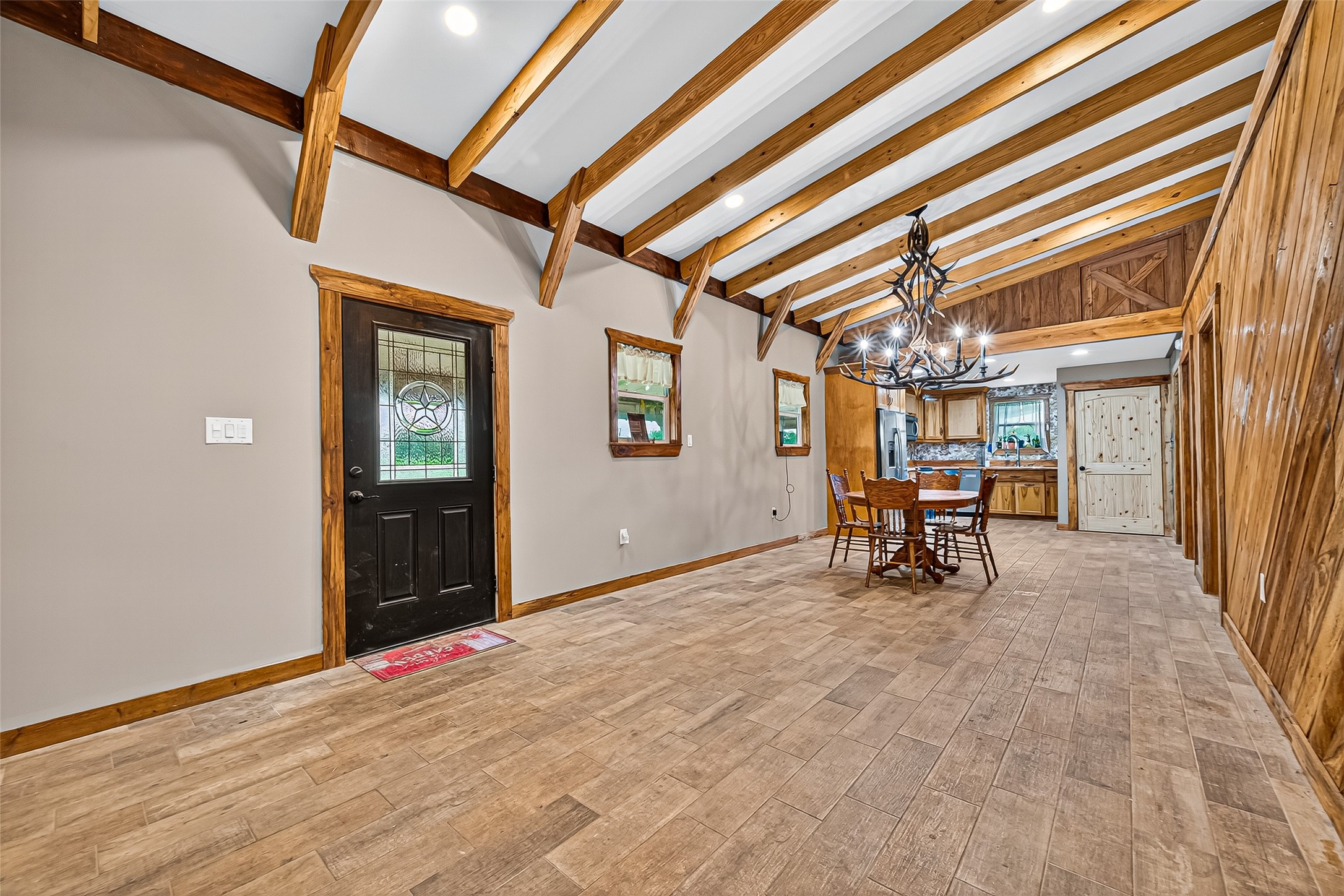 2080 Ave J Street Boling, TX 77420 - Photo 7 of 50 en empty room with furniture and a chandelier