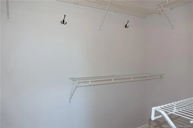 a view of a room with racks on the wall