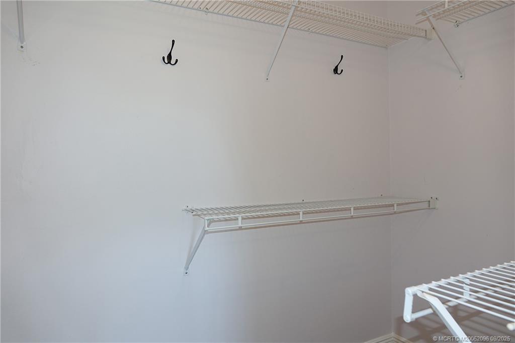 3101 Southeast Aster Lane, Unit 1908 Stuart, FL 34994 - Photo 11 of 24 a view of a room with racks on the wall
