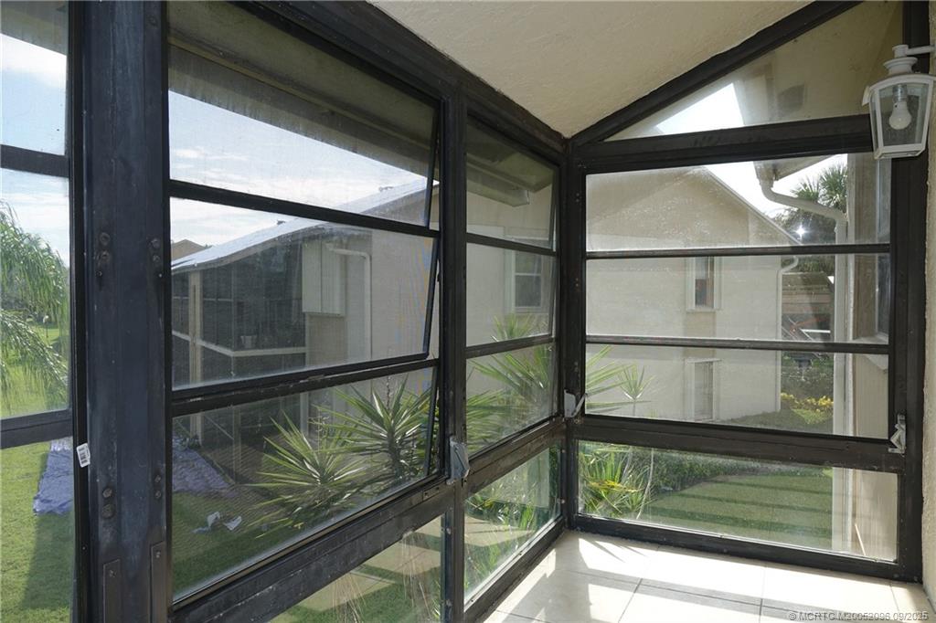 3101 Southeast Aster Lane, Unit 1908 Stuart, FL 34994 - Photo 15 of 24 a view of a glass door with a balcony