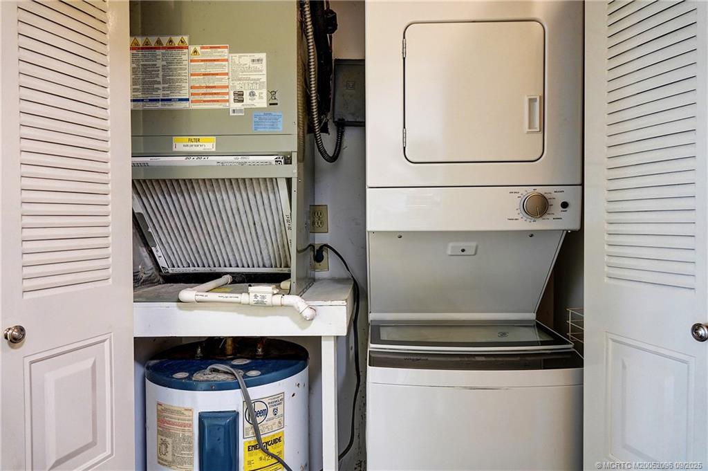 3101 Southeast Aster Lane, Unit 1908 Stuart, FL 34994 - Photo 18 of 24 a view of washer and dryer