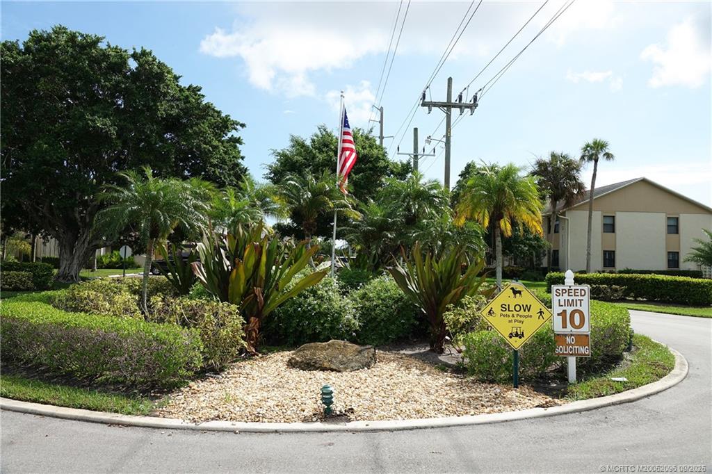 3101 Southeast Aster Lane, Unit 1908 Stuart, FL 34994 - Photo 21 of 24 a view of a house with a yard and sitting area