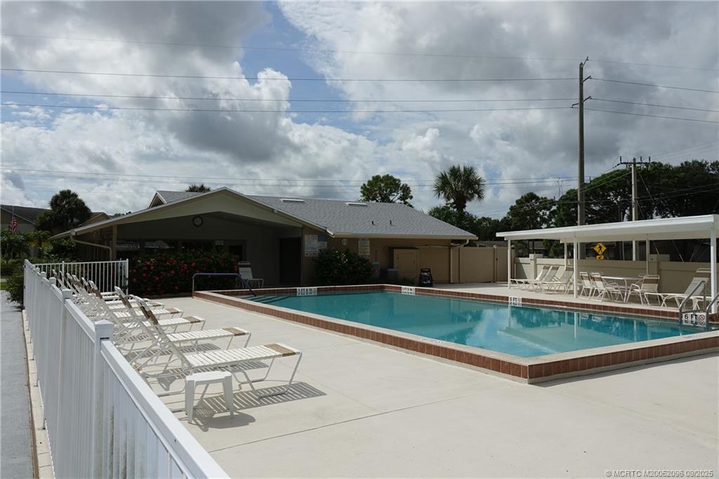 3101 Southeast Aster Lane, Unit 1908 Stuart, FL 34994 - Photo 23 of 24 a house view with a garden space