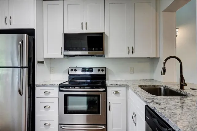 a kitchen with a stove and a microwave