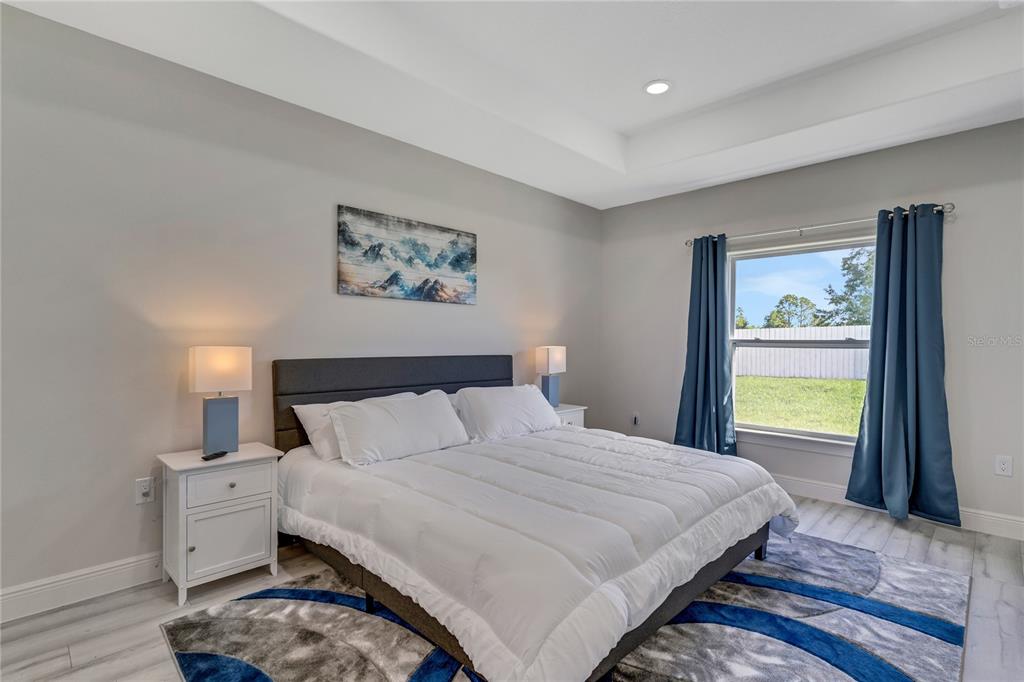 2201 Abalone Boulevard Orlando, FL 32833 - Photo 21 of 32 a bedroom with a bed and a large window