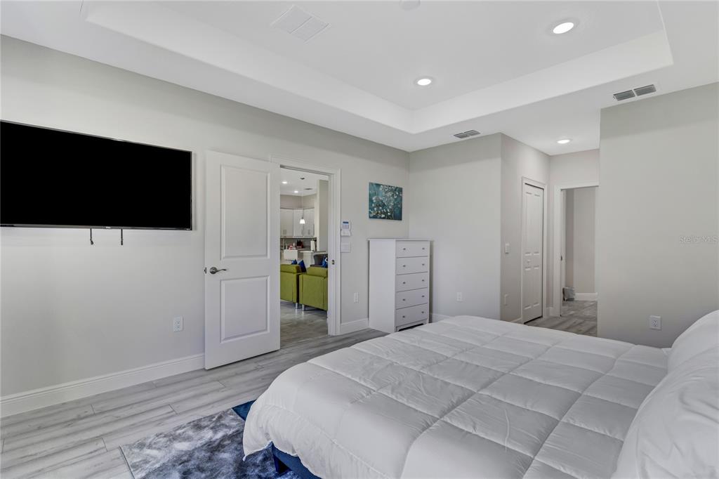 2201 Abalone Boulevard Orlando, FL 32833 - Photo 22 of 32 a bedroom with a bed and a flat screen tv
