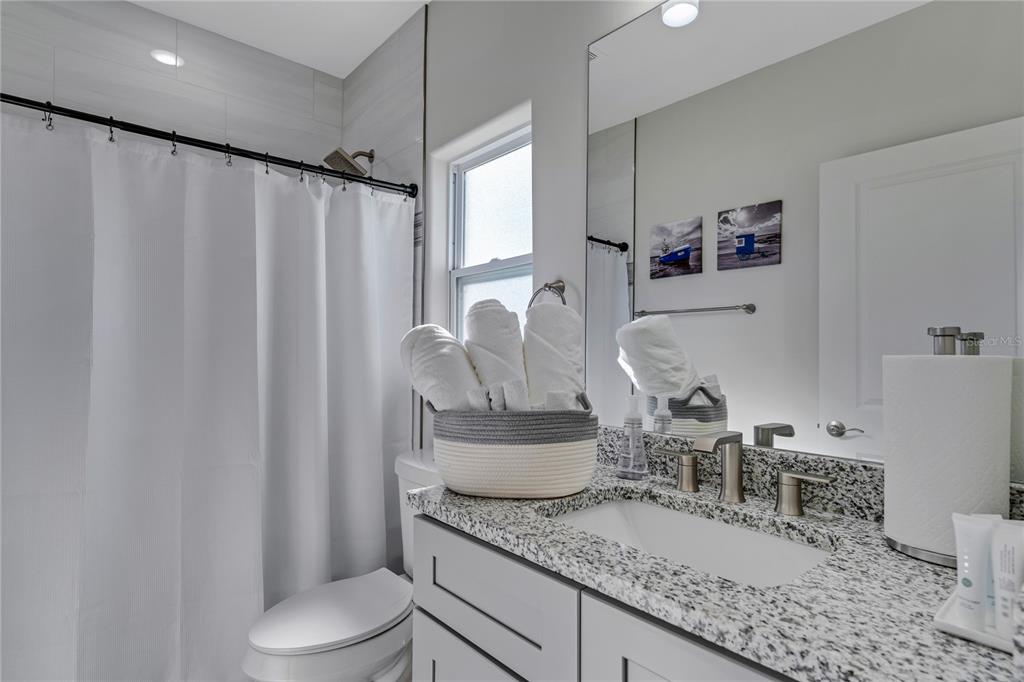 2201 Abalone Boulevard Orlando, FL 32833 - Photo 25 of 32 a bathroom with a granite countertop sink and a toilet